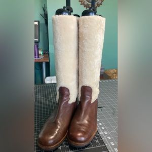 UGG CHRYSTIE SHEARLING AND LEATHER TALL RIDING BOOTS.